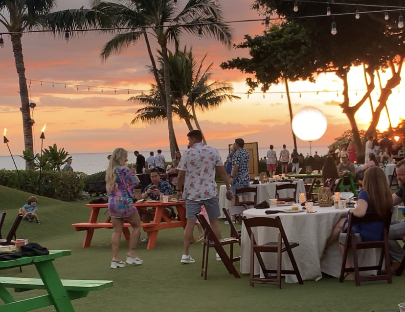 Hawaiian family gathering at sunset